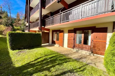 a house with a walkway in front of it at Bright apartment in Combloux near ski in Combloux
