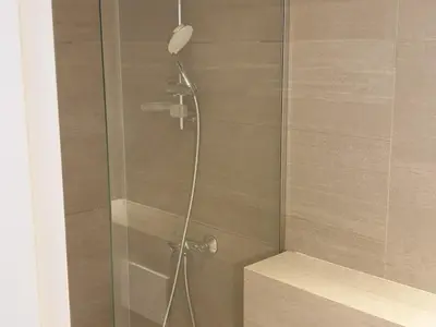 a shower with a glass door in a bathroom at Duplex Centre Station 5 Pers, Animaux Adm - FR-1-836-37 in Arâches-la-Frasse