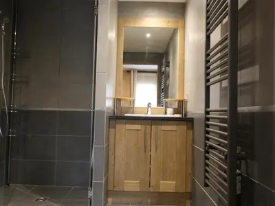 a bathroom with a sink and a mirror at Appartement standing 2 chambres, centre Arâches, 5 pers, parking, wifi - FR-1-836-8 in Arâches-la-Frasse