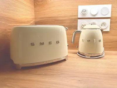 a toaster and coffee maker sitting on a counter at Appartement neuf 3 chambres avec jardin et parking à Arâches-la-Frasse - FR-1-836-48 in Arâches-la-Frasse