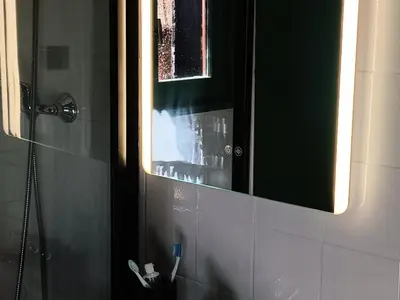 a bathroom with a mirror and a toothbrush at Studio 4 pers, cuisine équipée, parking privé, non-fumeur - FR-1-836-43 in Arâches-la-Frasse