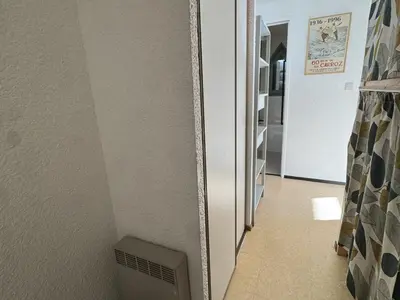 a hallway with a mirror on the wall at Studio 4 pers, cuisine équipée, parking privé, non-fumeur - FR-1-836-43 in Arâches-la-Frasse