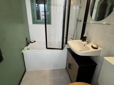 a bathroom with a tub and a sink and a shower at Studio 4 pers, cuisine équipée, parking privé, non-fumeur - FR-1-836-43 in Arâches-la-Frasse