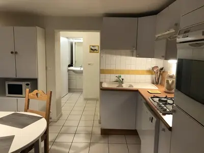 a small kitchen with a sink and a stove at Appartement Chalet 2 Chambres - 6 Pers, Wifi, Parking - FR-1-836-27 in Arâches-la-Frasse