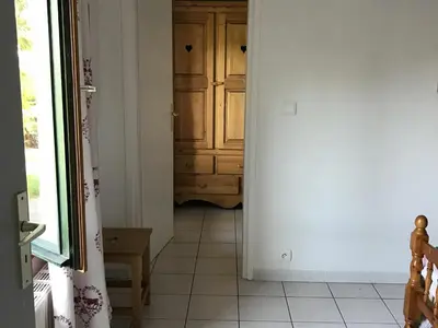a hallway with a cabinet and a tiled floor at Appartement Chalet 2 Chambres - 6 Pers, Wifi, Parking - FR-1-836-27 in Arâches-la-Frasse