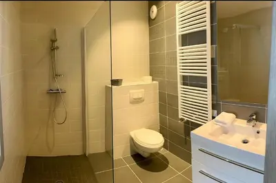 a bunk room with two bunk beds and a desk at Stay in a modern apartment in Chamonix in Chamonix-Mont-Blanc