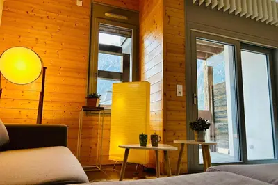 a living room with a table with food on it at Stay in a modern apartment in Chamonix in Chamonix-Mont-Blanc
