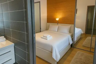 a room with a bed with three towels on it at Stay in a modern apartment in Chamonix in Chamonix-Mont-Blanc