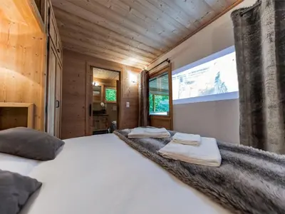 a hot tub in a room with snow covered trees at Chalet cosy avec jacuzzi, billard, wifi et animaux admis pour 8 personnes - FR-1-836-32 in Arâches-la-Frasse