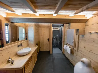 a bedroom with a bed and a tv in a room at Chalet cosy avec jacuzzi, billard, wifi et animaux admis pour 8 personnes - FR-1-836-32 in Arâches-la-Frasse
