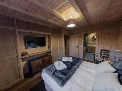 a large bathroom with a sink and a shower at Chalet cosy avec jacuzzi, billard, wifi et animaux admis pour 8 personnes - FR-1-836-32 in Arâches-la-Frasse
