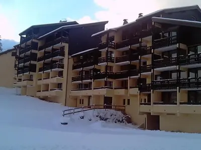 an apartment building in the snow with snow at Appartement rénové - 1 chambre, 6 personnes, animaux acceptés - FR-1-836-34 in Arâches-la-Frasse