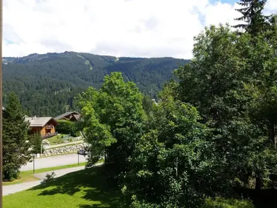 a view of a valley with trees and a house at Appartement rénové - 1 chambre, 6 personnes, animaux acceptés - FR-1-836-34 in Arâches-la-Frasse