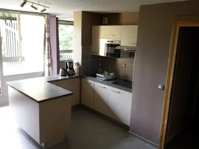 a kitchen with white cabinets and a counter top at Appartement rénové - 1 chambre, 6 personnes, animaux acceptés - FR-1-836-34 in Arâches-la-Frasse