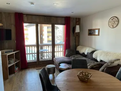 a living room with a couch and a table at Appartement moderne en centre-ville avec parking et animaux admis - 6 pers. - FR-1-836-49 in Arâches-la-Frasse