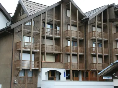 an apartment building with balconies on the side of it at Appartement moderne en centre-ville avec parking et animaux admis - 6 pers. - FR-1-836-49 in Arâches-la-Frasse