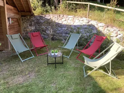 a tray of food on a table on a balcony at Chalet cosy 6 chambres, 14 pers, proche télécabine, parking, non fumeur - FR-1-836-28 in Arâches-la-Frasse