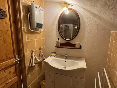 a bathroom with a sink and a mirror at Appartement de charme dans chalet rénové - Animaux et parking - FR-1-836-54 in Arâches-la-Frasse