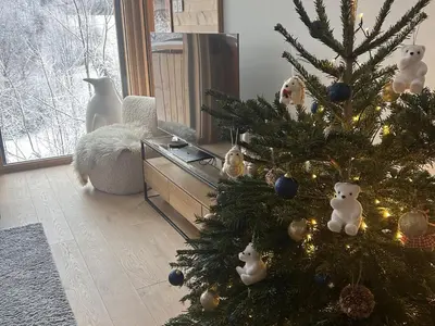 a christmas tree with ornaments on it in a living room at Nouveau ! Appartement de standing 3 chambres avec balcon et parking couvert - FR-1-836-42 in Arâches-la-Frasse