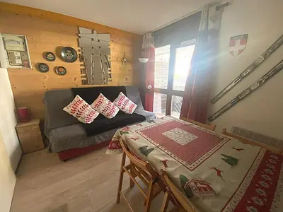 a room with a couch and a table in a room at Studio à Morillon pour 4 pers. proche pistes et commerces - FR-1-815-105 in Morillon