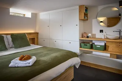 a bedroom with a bed with a bowl on it at Chalet Juno - Chamonix All Year in Chamonix-Mont-Blanc