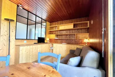 a living room with a couch and a table at Superb apartment in Megève in Megève
