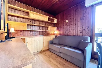 a living room with a couch and a desk at Superb apartment in Megève in Megève