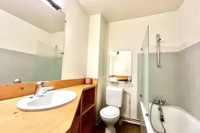 a bathroom with a sink and a toilet and a tub at Superb apartment in Megève in Megève