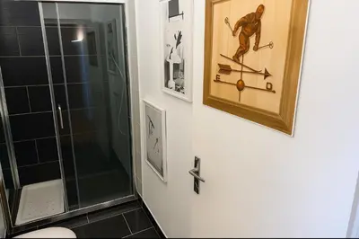 a bathroom with a shower and a picture on the wall at Bright apartment for 6 people in Chamonix in Chamonix-Mont-Blanc