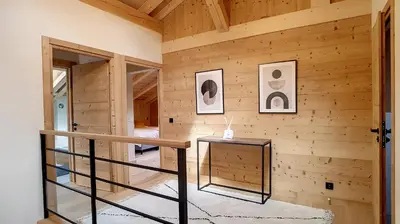 a dining room with a wooden table and chairs at Chalet des Pres- 3 chambres - JAILLET - in Demi-Quartier