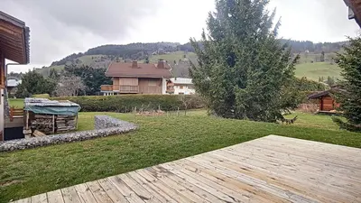 a bedroom with two beds and a chair at Chalet des Pres- 3 chambres - JAILLET - in Demi-Quartier
