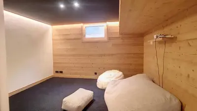 a small room with a bed and a window at Chalet des Pres- 3 chambres - JAILLET - in Demi-Quartier