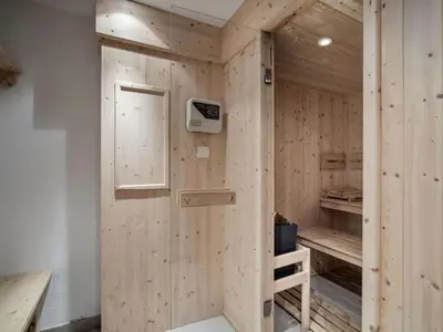 a bedroom with a bed and a wooden wall at Chalet à Saint-Gervais-les-Bains, 11 pers, sauna, Wi-Fi, parking - FR-1-663-59 in Saint-Gervais-les-Bains