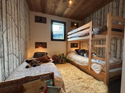 a bedroom with two bunk beds with teddy bears on them at New Chalet Facing The Aiguilles De Chamonix in Les Houches