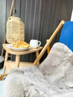 a plate of food on a table with a coffee cup at Le Gemma in Saint-Gervais-les-Bains