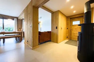 a living room with a woodburning stove in a house at Apartment with garden and proximity to activities in Chamonix-Mont-Blanc
