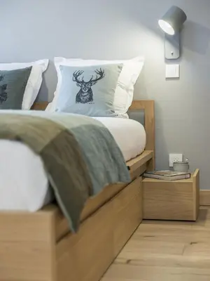 a bedroom with a bed with a deer pillow at White Dream - Vue et confort en centre-ville in Chamonix-Mont-Blanc