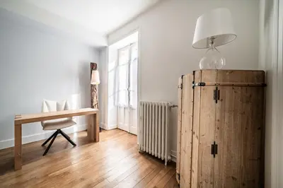 a room with a desk and a wooden refrigerator at Apartment Brina Chamonix - by EMERALD STAY in Chamonix-Mont-Blanc