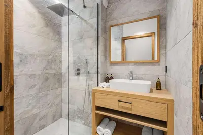 a bathroom with a sink and a shower at Chalet Larzay - Chamonix in Chamonix-Mont-Blanc