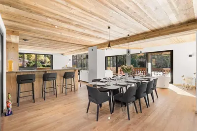 a dining room with a long table and chairs at Chalet Larzay - Chamonix in Chamonix-Mont-Blanc