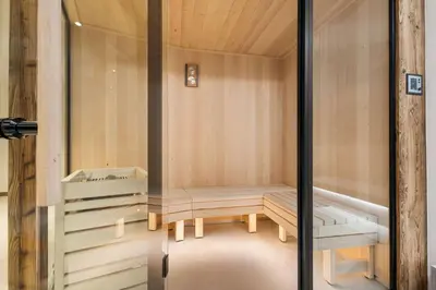 a sauna with two benches in a room at Chalet Rémond - Vue Montagnes in Chamonix-Mont-Blanc