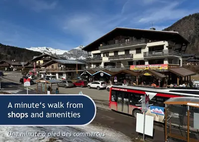 a bus is parked in front of a building at Les Grands Tetras in Les Houches