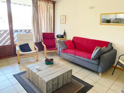 a living room with a couch and a coffee table at Appartement 3 pièces, 6 personnes, au pied des pistes - Morillon 1100 - FR-1-815-103 in Morillon