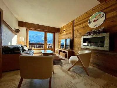 a living room with a view of a mountain at The Balcony of the Giant in Combloux in Combloux