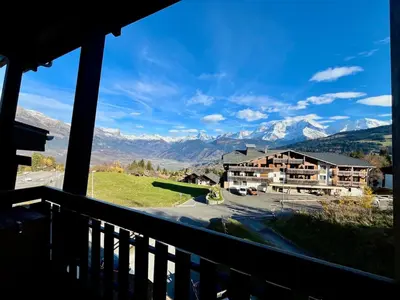 a view of the mountains from the balcony of a hotel at The Balcony of the Giant in Combloux in Combloux