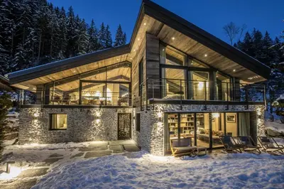 a home in the snow at night at Sumptuous Chalet In Chamonix-Mont-Blanc in Chamonix-Mont-Blanc