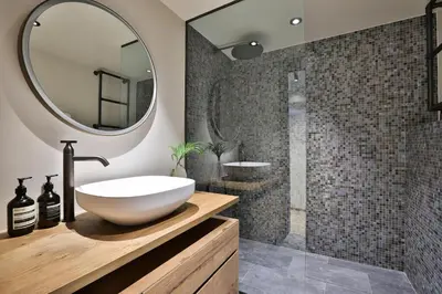 a bathroom with a sink and a mirror at Sumptuous Chalet In Chamonix-Mont-Blanc in Chamonix-Mont-Blanc