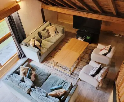 an overhead view of a living room with a couch and chairs at Maison du Tailleur de Pierre, 5 bedroom apartment, 3 bathrooms, ski-bus, parking in Samoëns