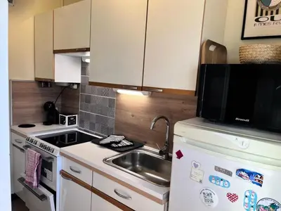 a small kitchen with a sink and a refrigerator at Résidence Castel Des Roches C - CASTEL DES ROCHES C57 MAE-3063 in Saint-Gervais-les-Bains