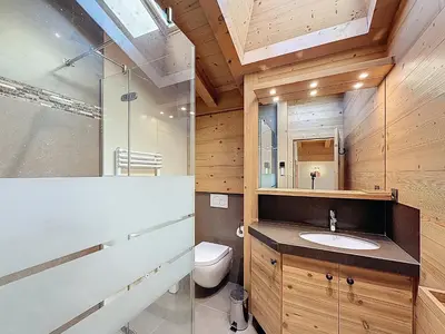 a bathroom with a toilet and a sink at Chalet spacieux 5 chambres proche ski bus, vue Mont-Blanc - FR-1-560-172 in Combloux